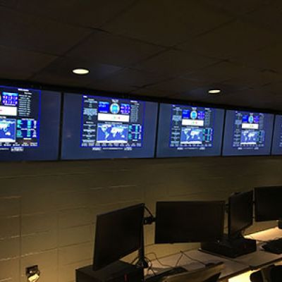 Radar console displayed on multiple screens in an office