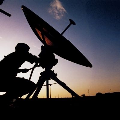 Soldier moving a satellite